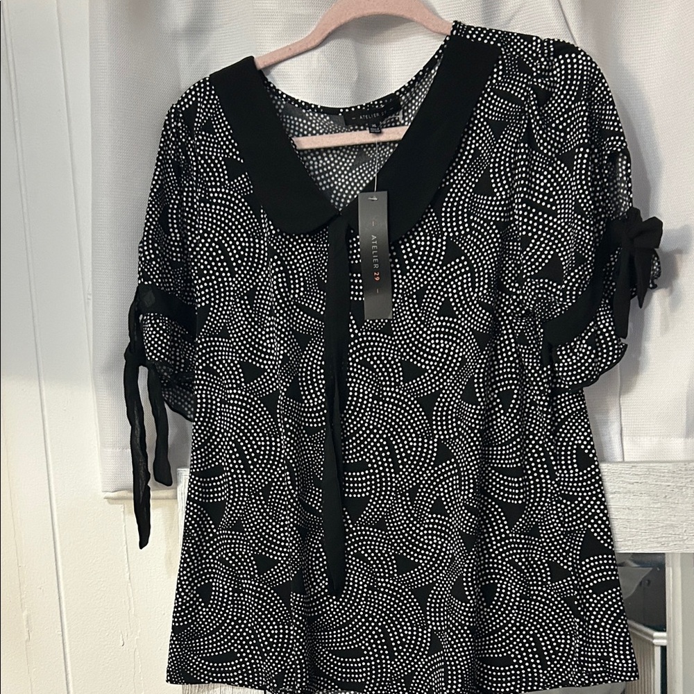 Elegant Black and White Patterned Blouse